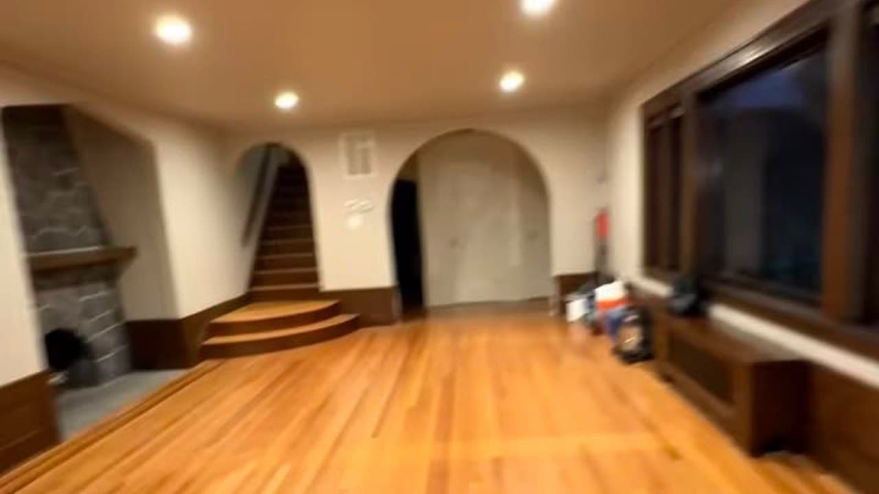 Open living space with freshly cleaned hardwood floors